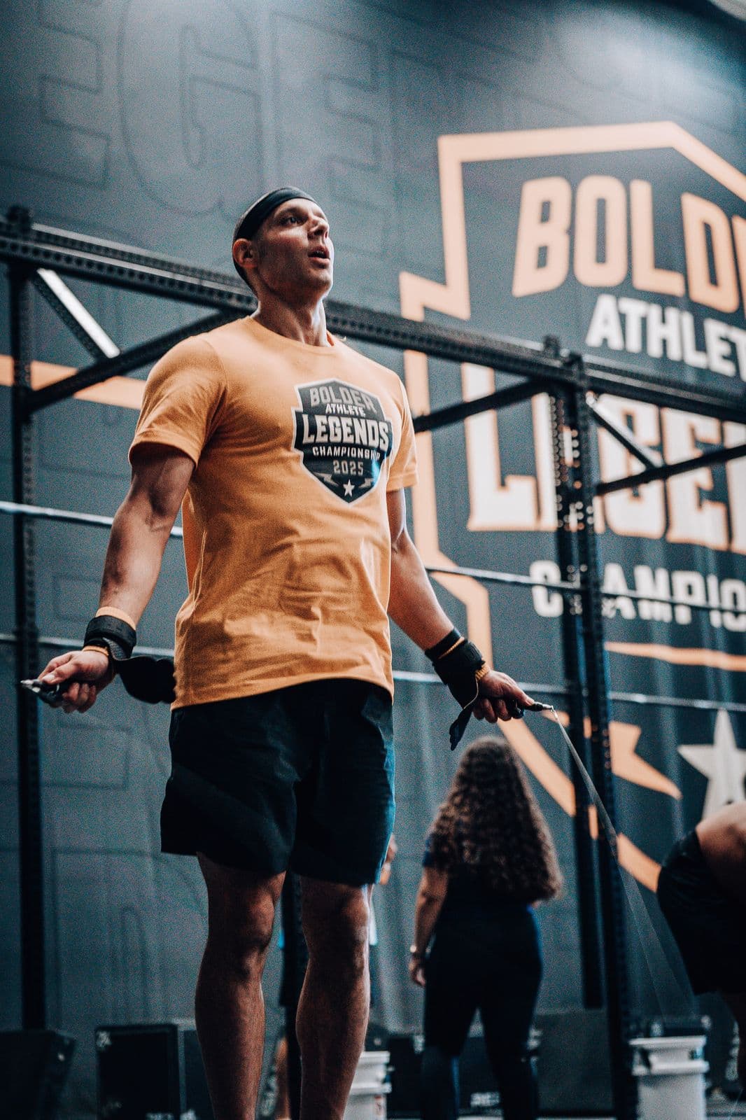 Athlete standing in front of a Bolder Athlete banner