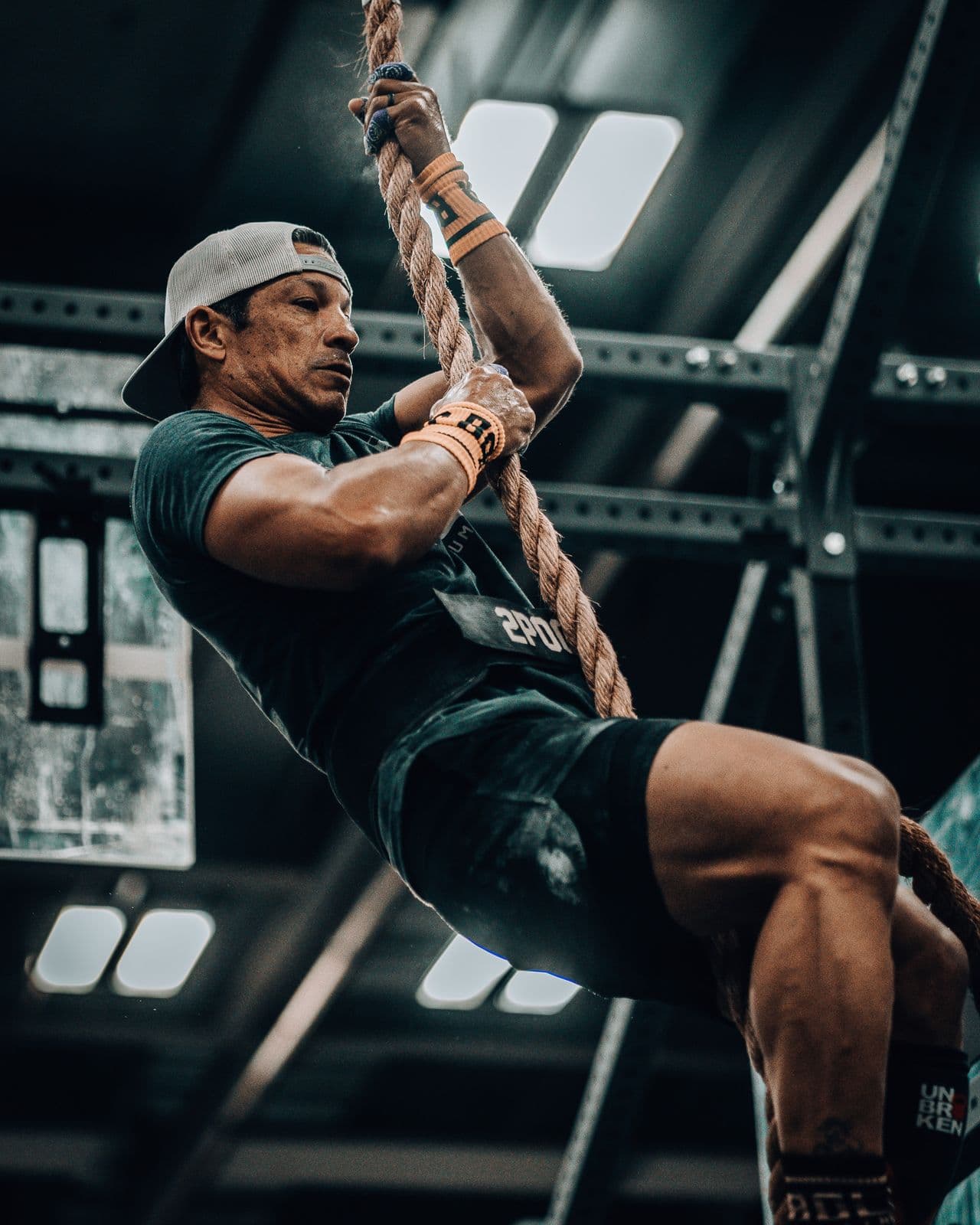 Athlete climbing a rope